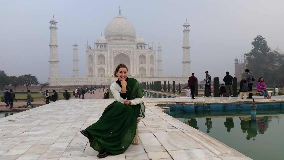 Taj Mahal visit with the fountain as a central piece sari India tourist