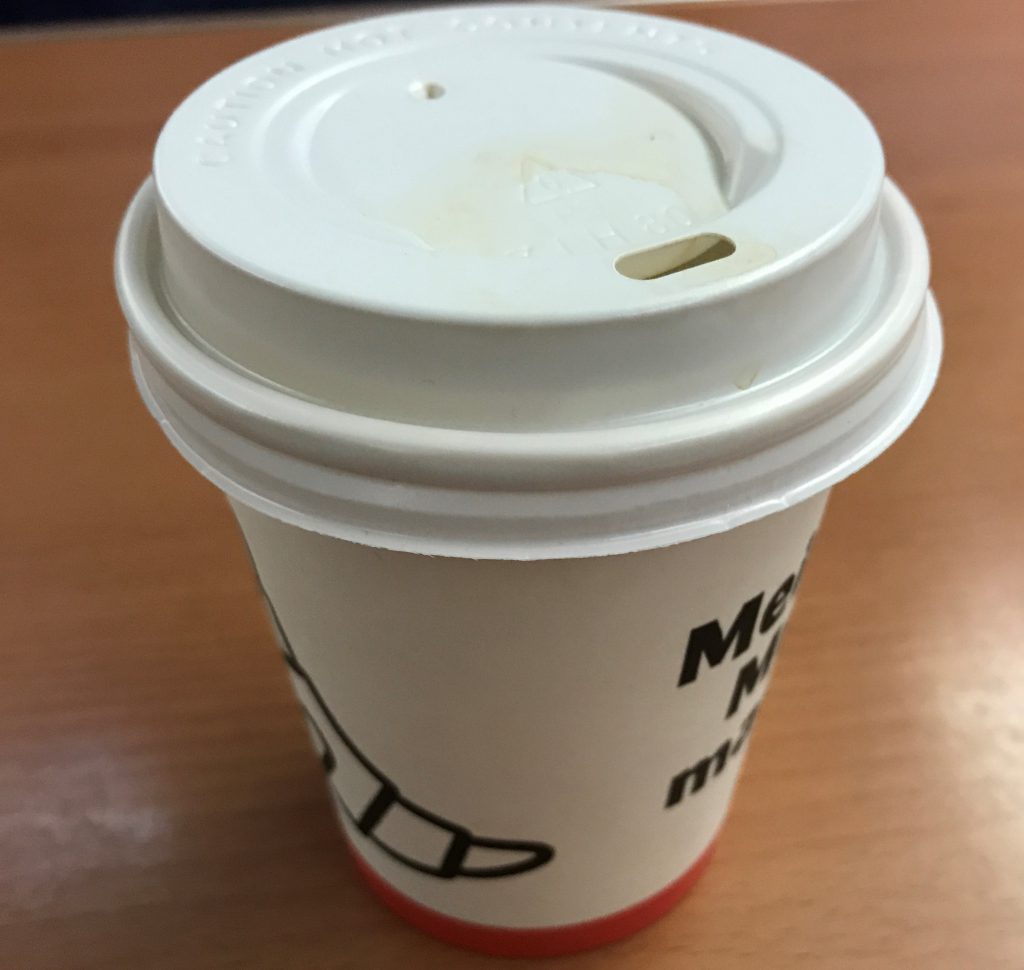 single-use coffee cup made out of paper plastic and other materials hard to recycle extra waste