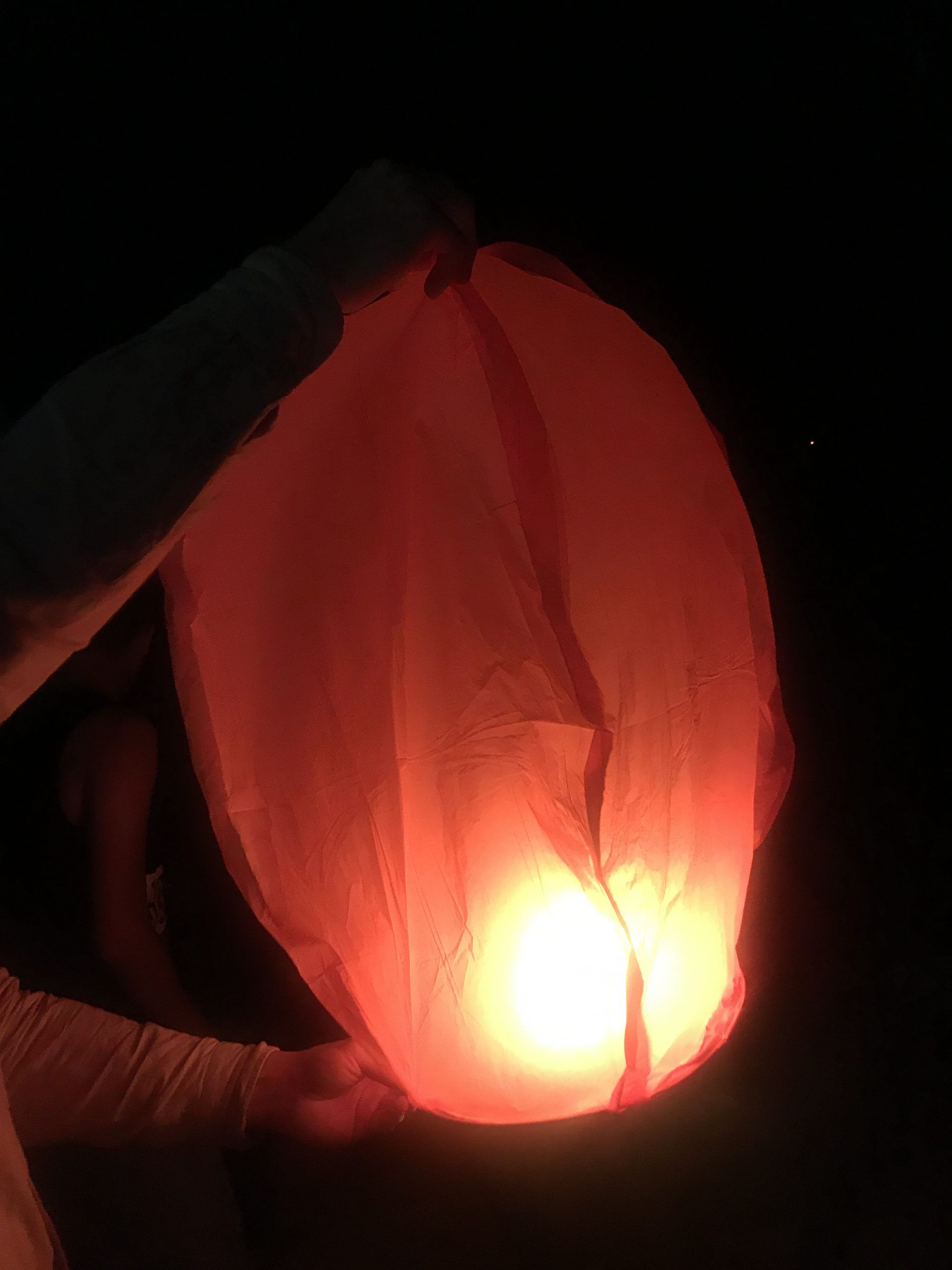 The lanterns we used on New Year's Eve. You light up the part below and when the paper baloon is filled with hot air it can be lifted in the air and carried far away by the wind. 