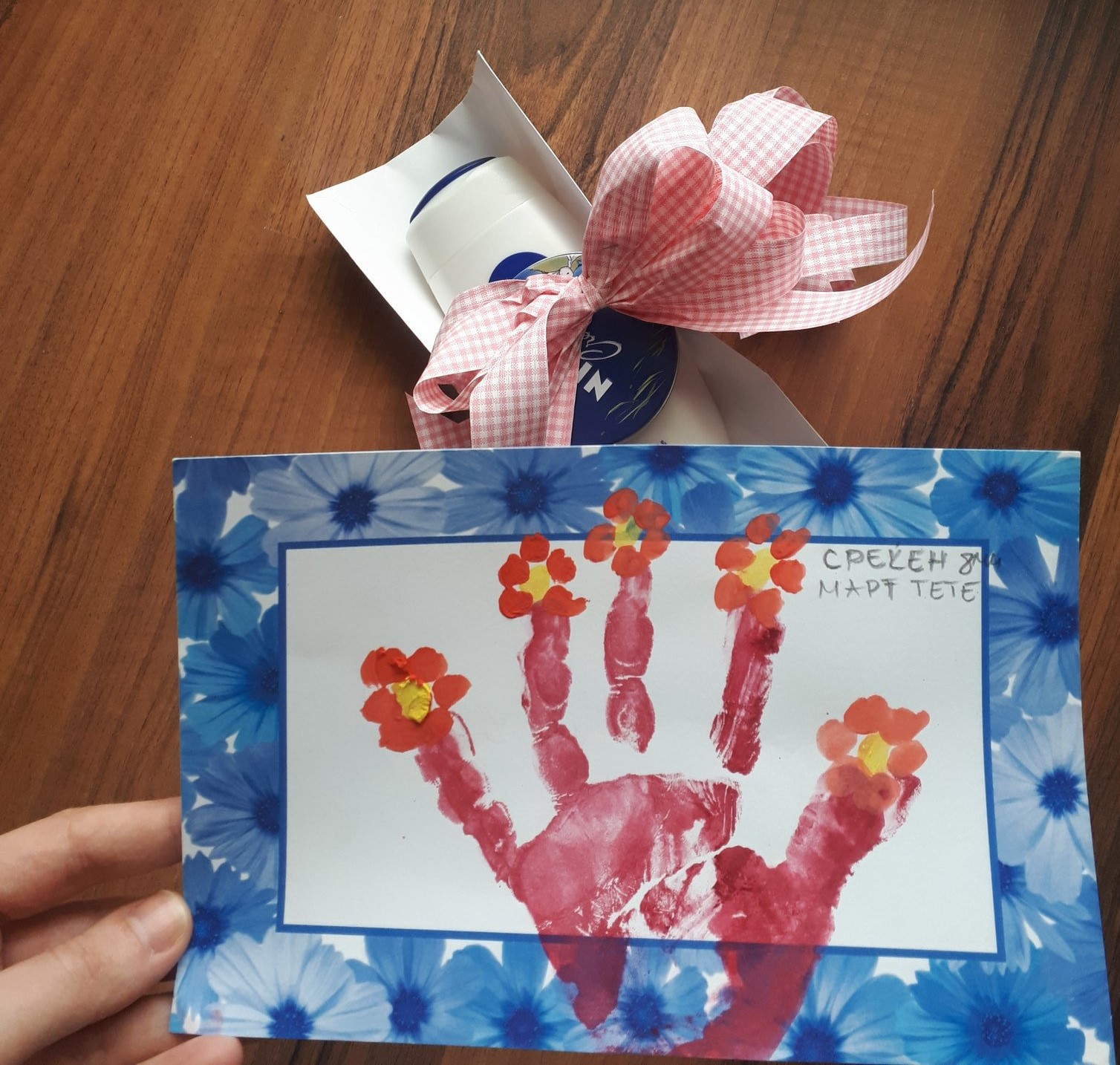 beautiful card with flowers and hand as a gift for an aunt for 8th of march