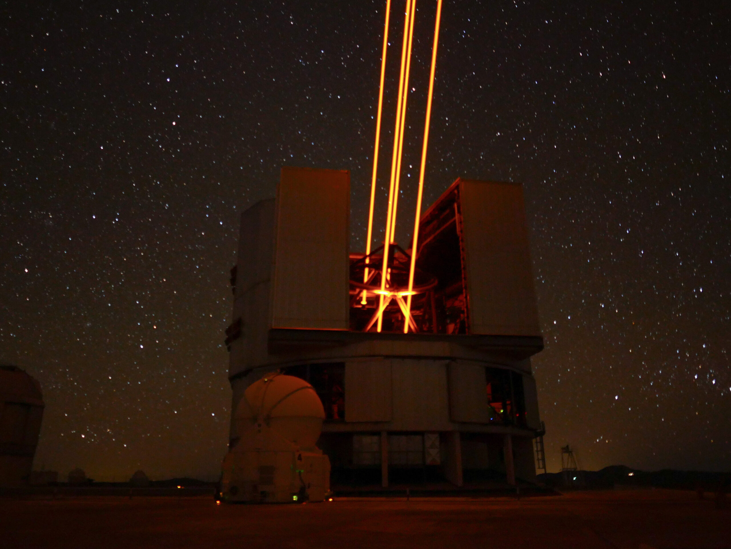 adaptive optics instrument at the Paranal observatory in Chile. Creating four artificial start with lasers. Phto credits: Dr. Johanna Hartke, a post-doctoral fellow at ESO.